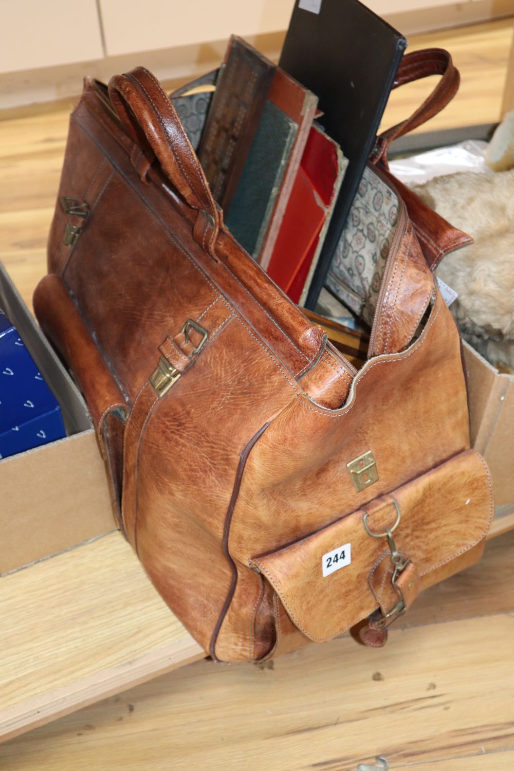 A quantity of board games, cards, shakes and a collection of cribbage boards in a large Gladstone-style bag